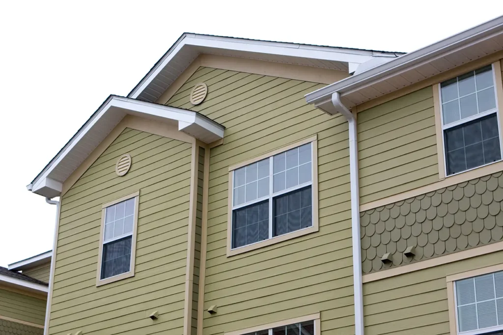 Residential buildings using fiber cement board-MMJ7107 as batten siding