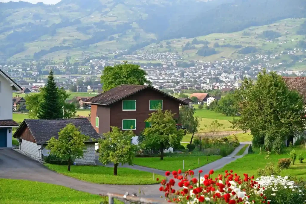 The house with a mixed style of "countryside + modern" is made of Siding Fiber Cement Board on the lawn road