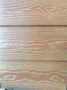 Close-up of the front view of the wall decorative wood grain board installed in Lap siding